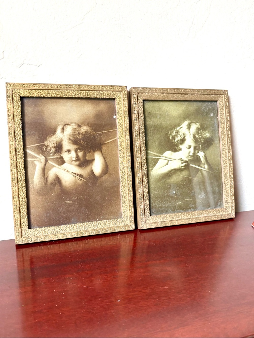 Antique framed prints by M.B. Parkinson titled Cupid Awake and Cupid Asleep